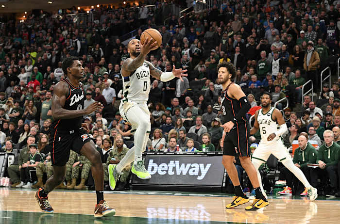 Milwaukee Bucks guard Damian Lillard (0) drives to the basket against the Detroit Pistons